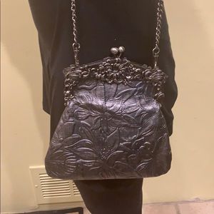 Silver cross body clutch style bag